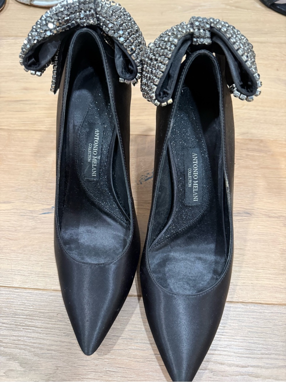 ANTONIO MELANI Black Satin Pointed Toe Pumps with Crystal Bow Accent